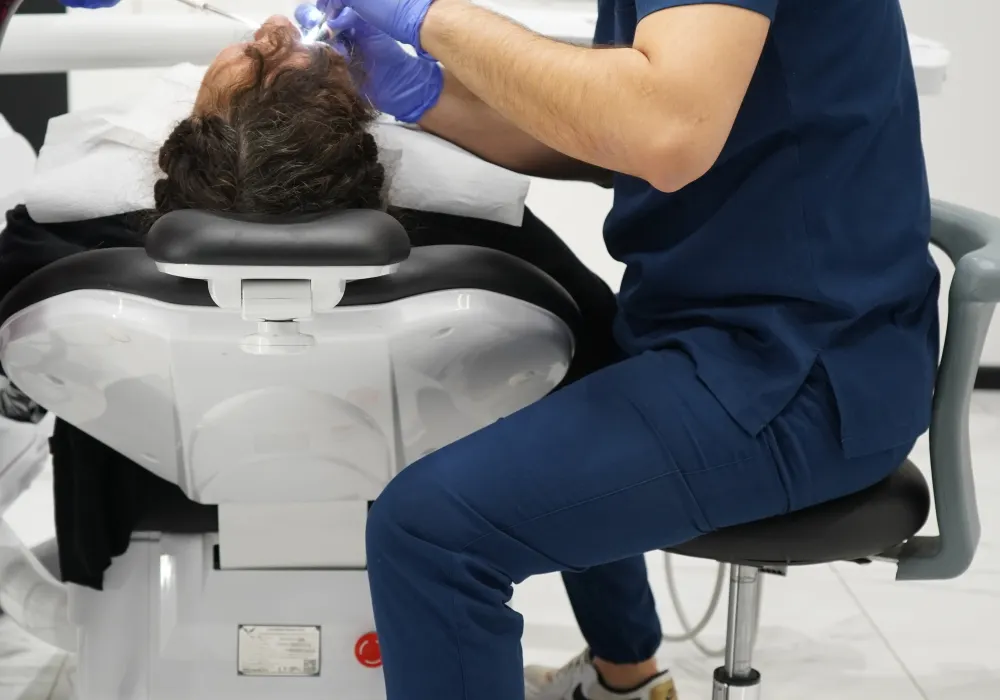 Dentist performing a procedure with professional equipment